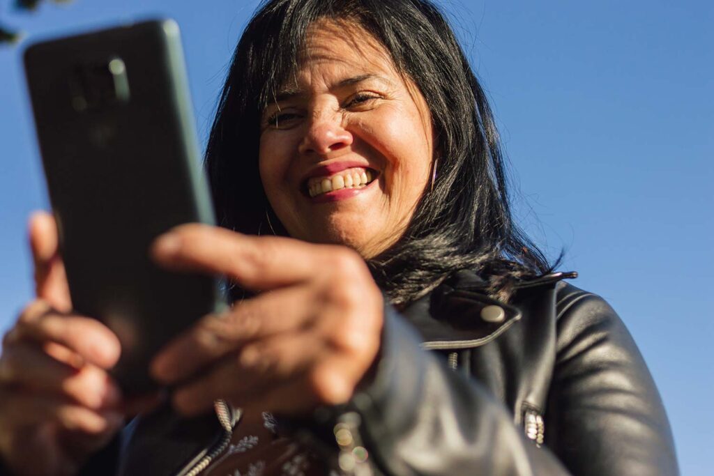 Woman completing surveys for money on her smartphone